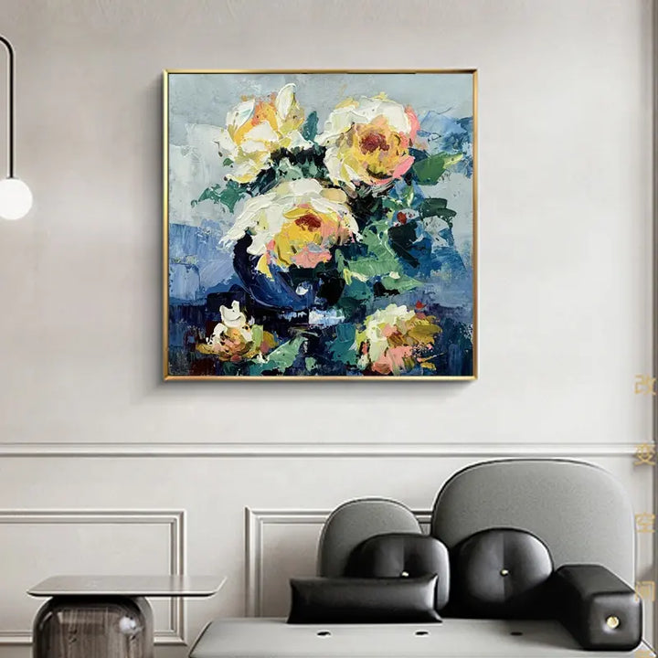 A vibrant painting of yellow roses in a vase, beautifully displayed on a wall.