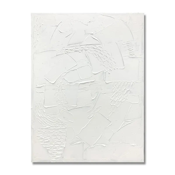 A white painting with abstract shapes, showcasing a blend of colors and forms.