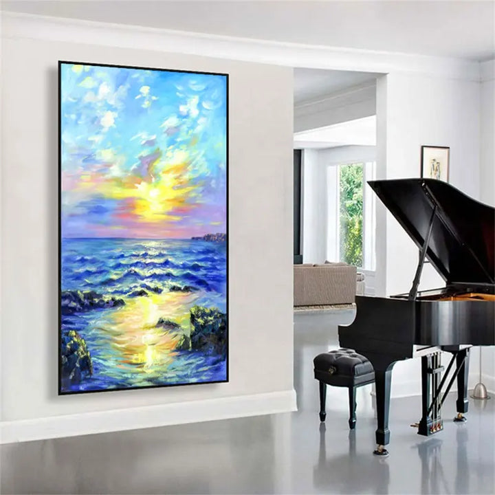 A serene painting of a sunset over the ocean, adorning the walls of a cozy living room.