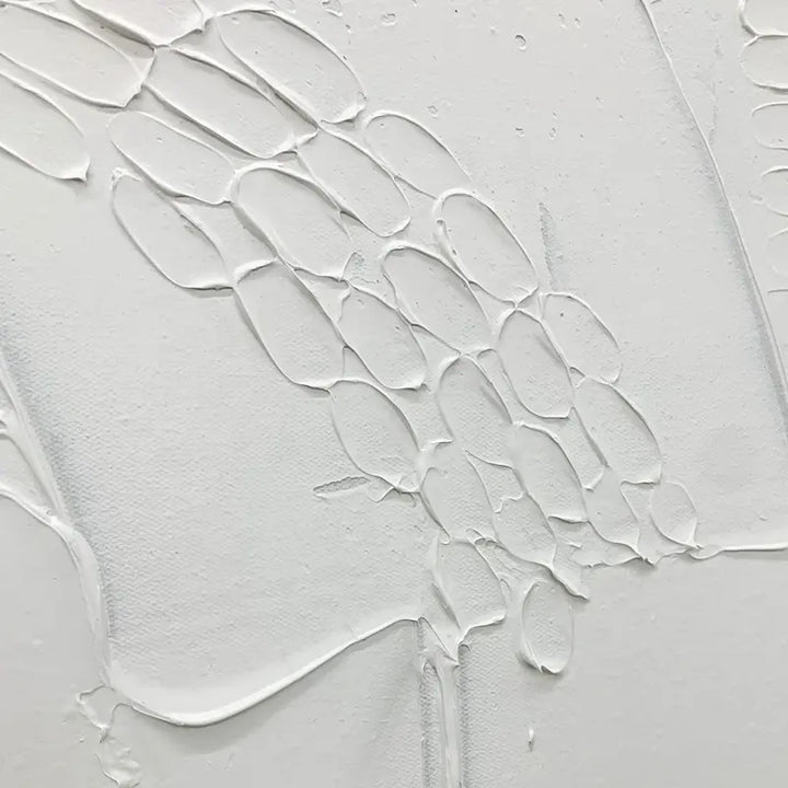 A white painting on a white background, showcasing simplicity and minimalism.