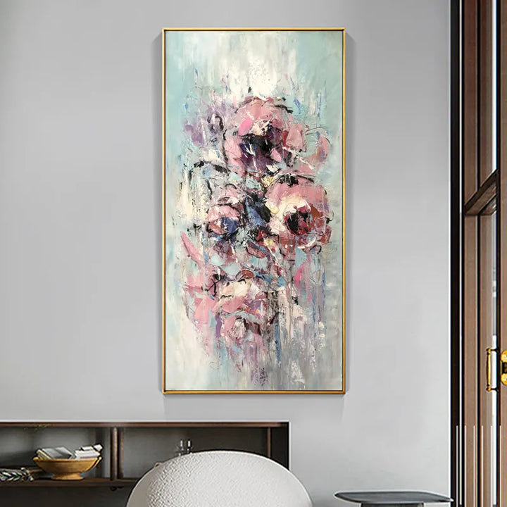 A vibrant painting of pink and blue flowers, capturing the beauty and colors of nature in a large artwork.