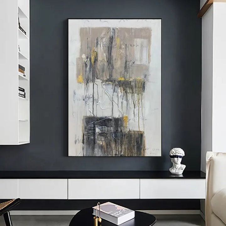 A large painting above a white couch, adding elegance and artistic flair to the room's decor.