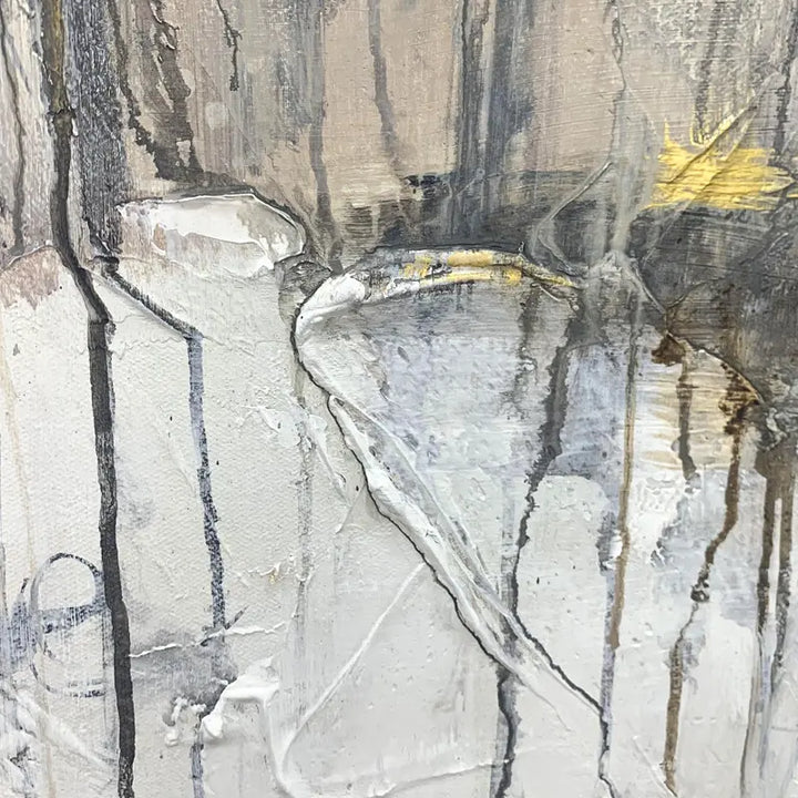 An abstract painting featuring a blend of white and gray paint, creating a visually captivating composition.