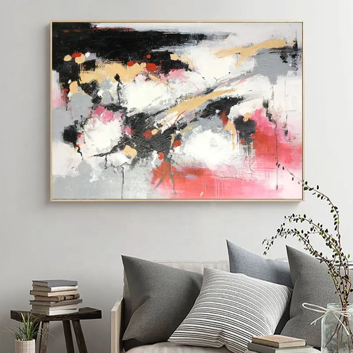 Abstract painting on living room wall. Vibrant colors and bold brushstrokes create a captivating visual experience.