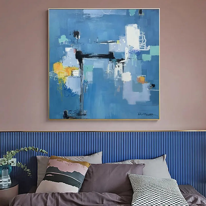 A vibrant abstract painting adorns the wall above a bed, adding a touch of artistic flair to the room.