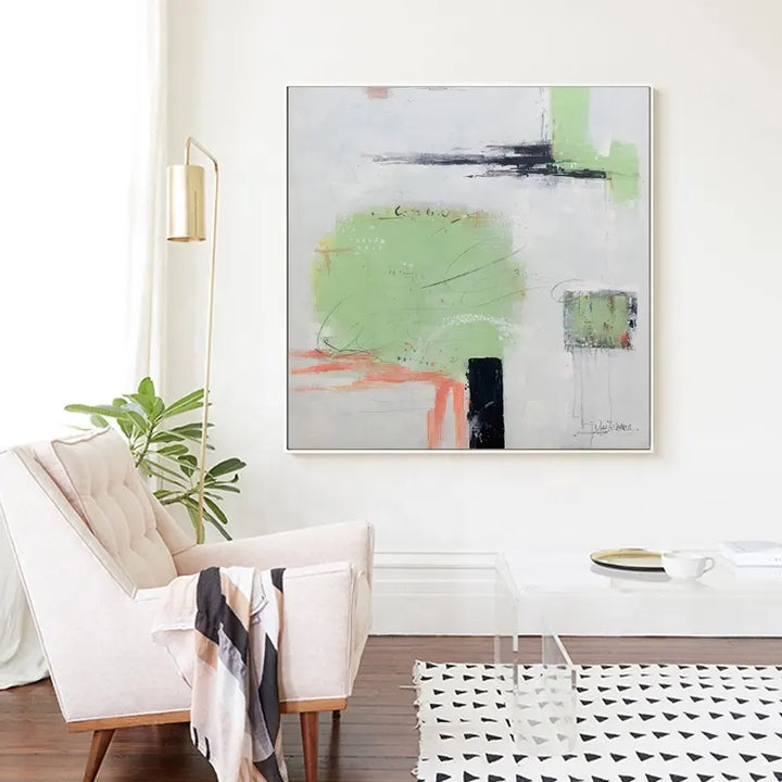 An abstract painting adorns a living room, adding a touch of artistic flair to the space.