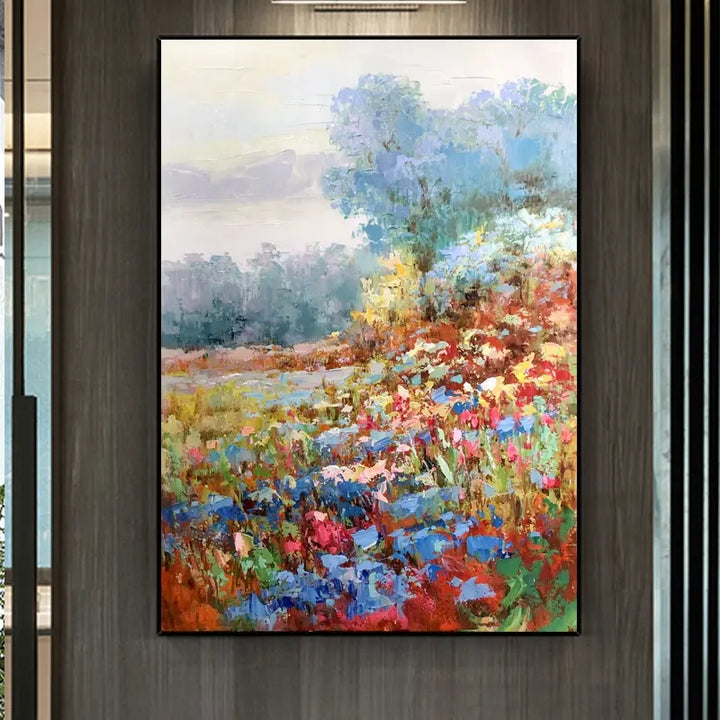 An abstract painting of colorful flowers blooming in a vast field, creating a vibrant and lively scene.