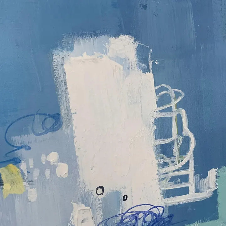 An abstract painting featuring a blend of blue and white paint, creating a visually captivating composition.