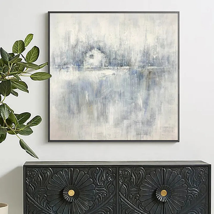 A painting above a black and white sideboard, adding elegance and visual interest to the room's decor.