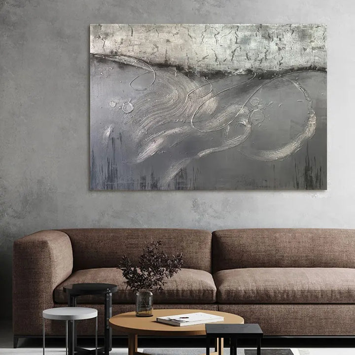 A vibrant abstract painting adorns the living room wall, adding a touch of artistic flair to the space.