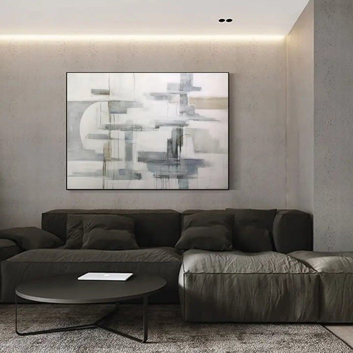 A contemporary living room with a prominent wall painting.