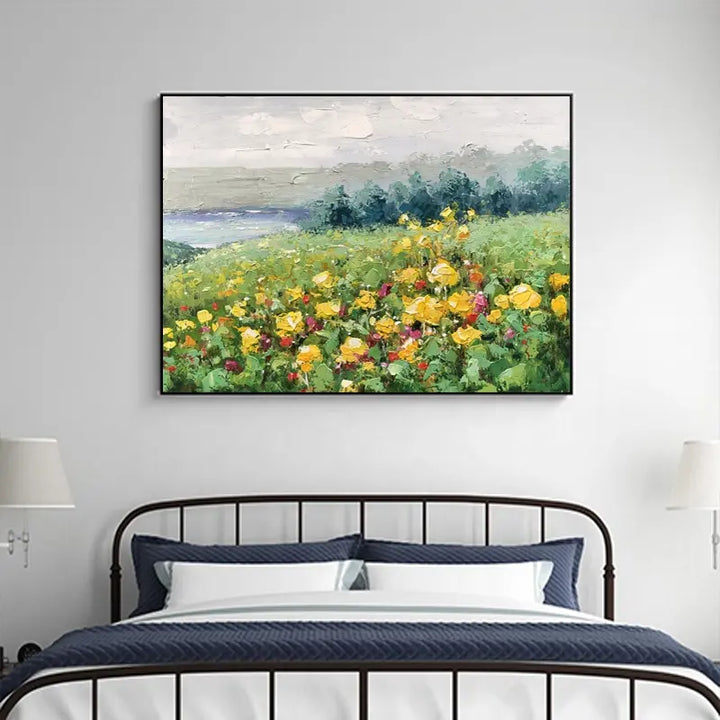 A vibrant painting of yellow flowers beautifully arranged on a bed, adding a touch of warmth and cheerfulness to the room.