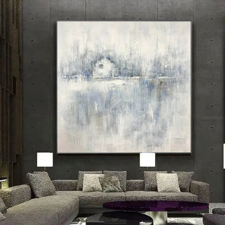 A modern living room with a large abstract painting hanging on the wall.