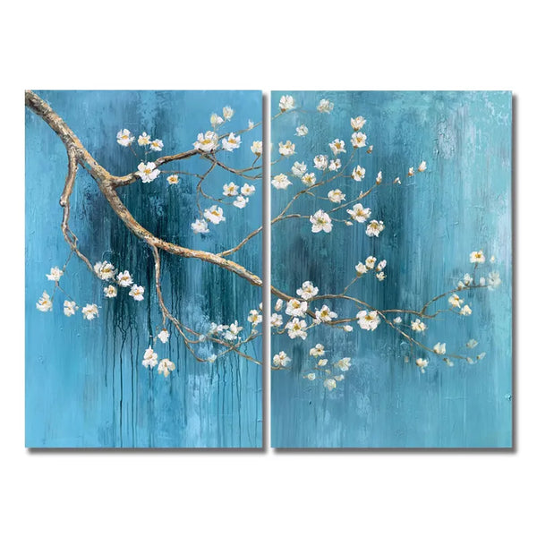 Two blue and white floral paintings on display, adding a touch of elegance and nature to the room.