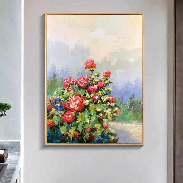 A vibrant painting of red roses adorning a wall, adding a touch of elegance and beauty to the surroundings.