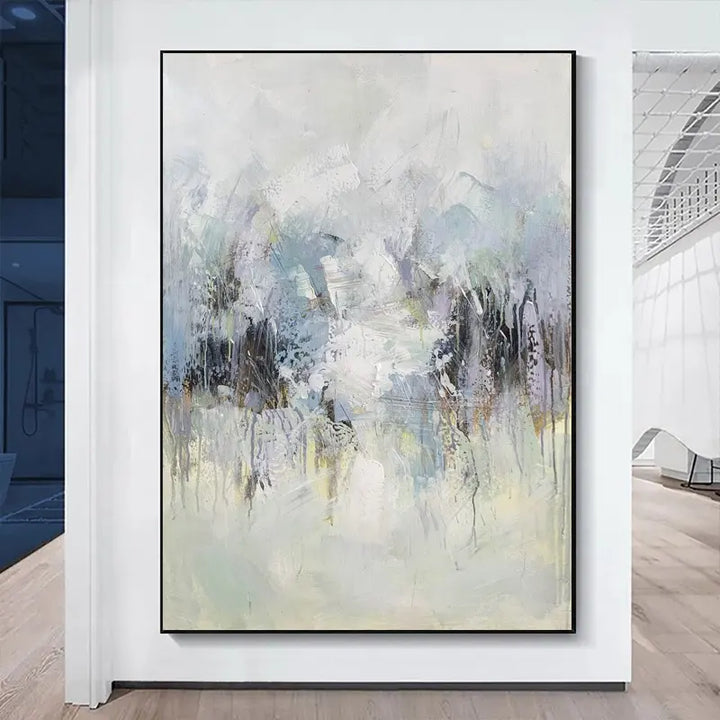 An abstract painting displayed in a white room, showcasing vibrant colors and dynamic brushstrokes.