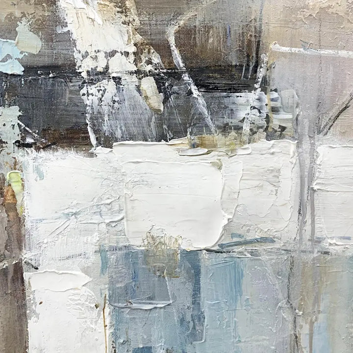 An abstract painting featuring a blend of white, blue, and gray colors, creating a visually captivating composition.