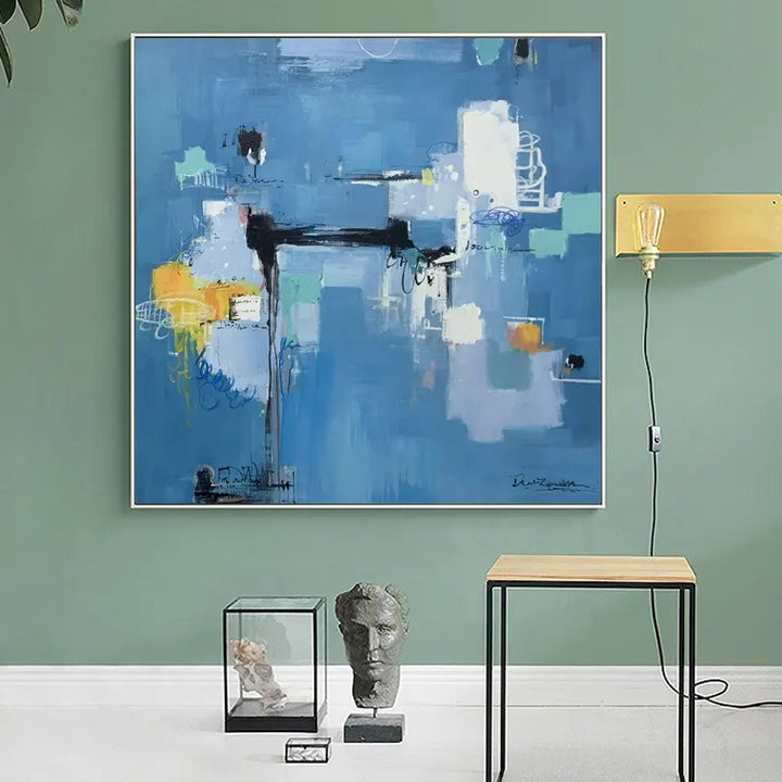 Abstract painting on canvas adds a vibrant touch to the living room decor, creating a visually captivating focal point.