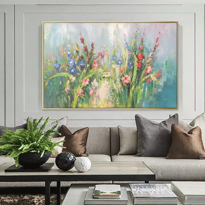 A vibrant painting of flowers adorns the living room, adding color and beauty to the space.