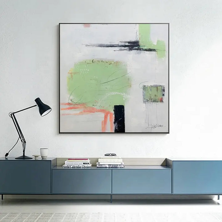 An abstract painting adorns the living room wall, adding a touch of artistic flair to the space.