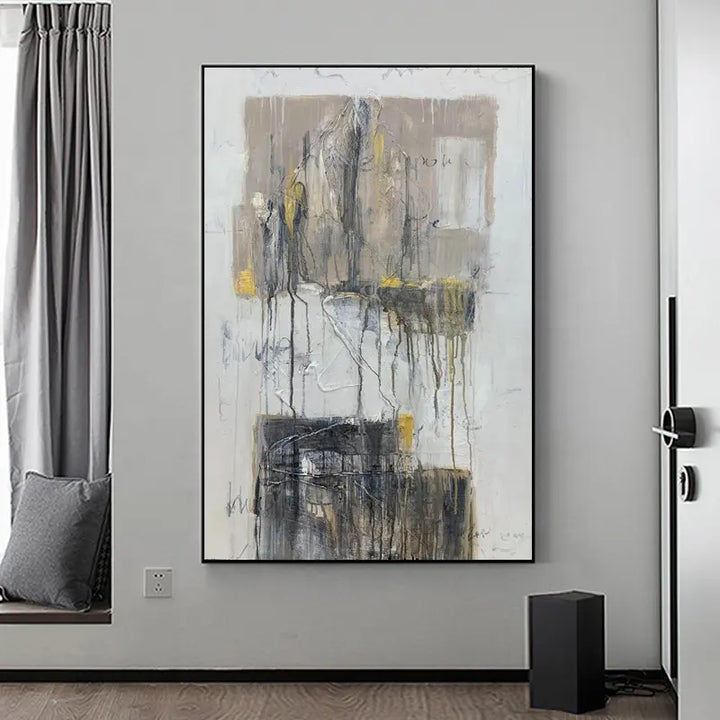 A room with a large abstract painting hanging on the wall.